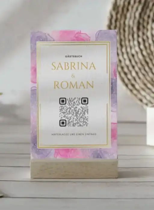 Wedding guest book with QR code for collecting photos, elegant floral design.